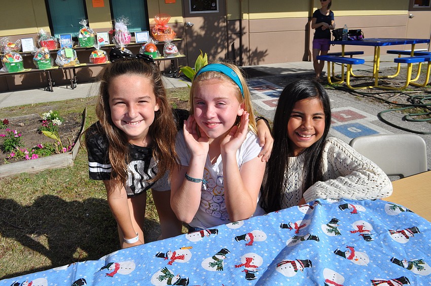 Hannah Tisone, Cassidy Lawless and Christiani Saphanthong man their class's 