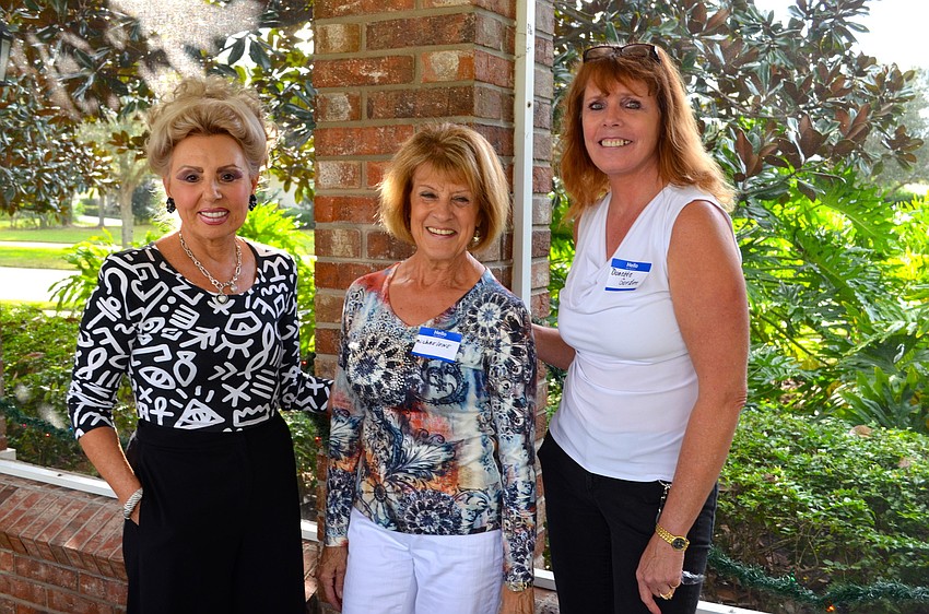 Sandy Rahman, Michaelene Houze and Donette Gordon organize the snack area.