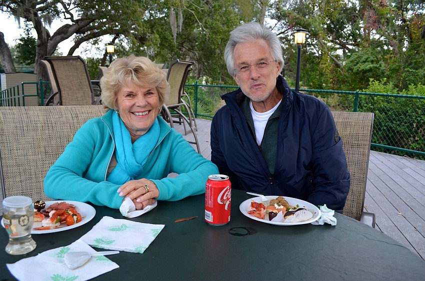 Barbara and Jim Pappas enjoy their food in a quiet corner.