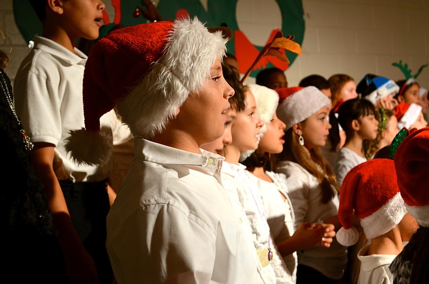 Jake Lotozynski sings with his classmates and peers.
