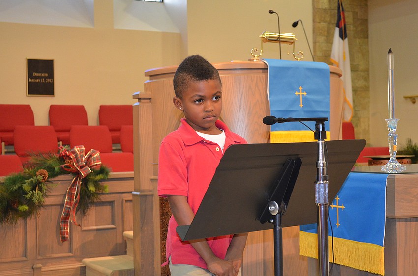 Malik Taylor recites a scripture.