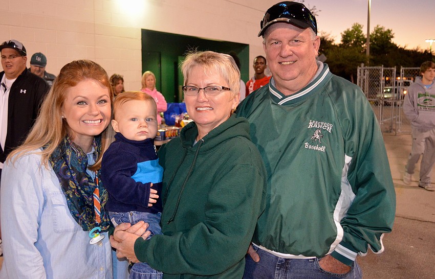 The Kennedy family â€”Â Kelly, Ryker, Kim and Mike â€” wait for the games to begin.