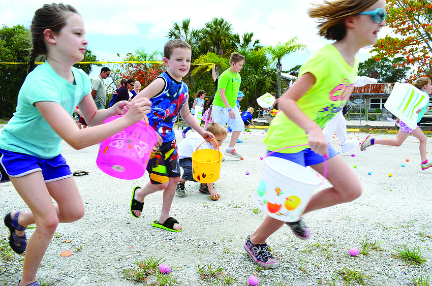 Children run for eggs at the 