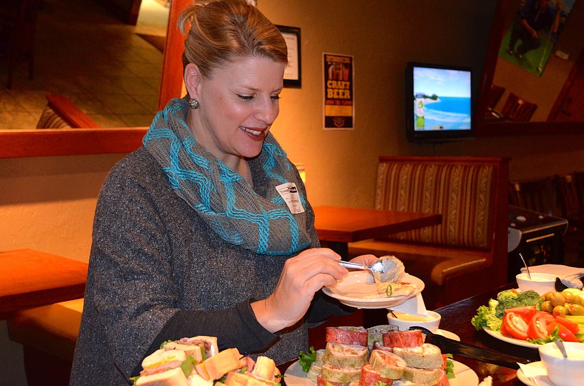 Jacki Dezelski enjoys the snacks.