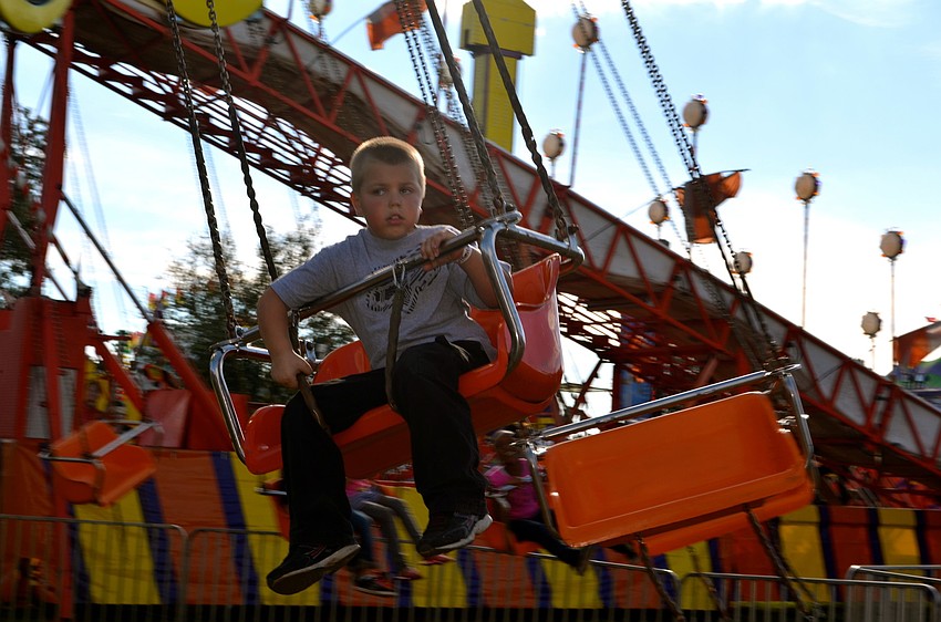 Xavier Fontanez holds on tight during the midway ride.