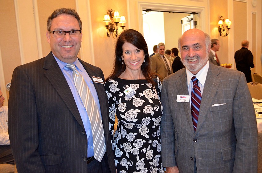 Greg Courter, Jennie Lucier and Howard Katz make time for small talk.