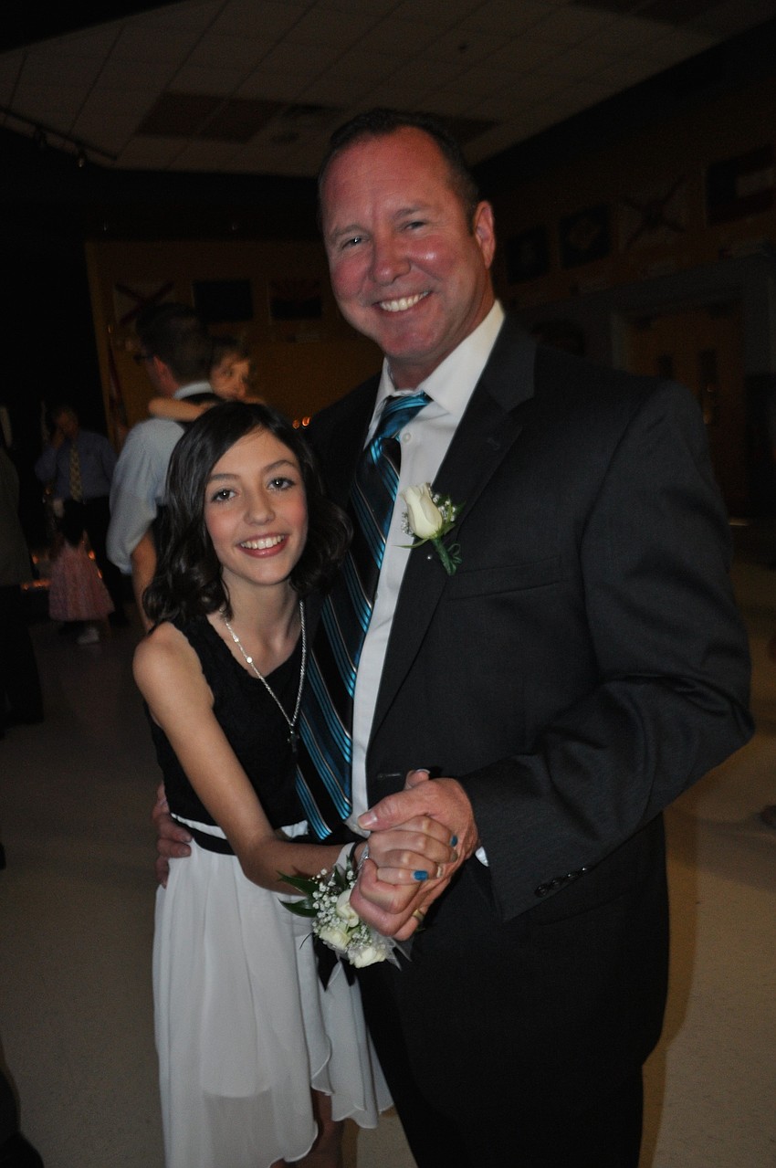 Riley Holton attends her first father-daughter dance with her father, Russell.