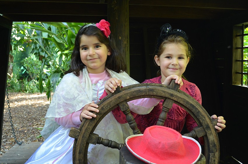 Simone Velez and Emma Witherspoon explore the gardens at Sarasota Childrenâ€™s Garden.
