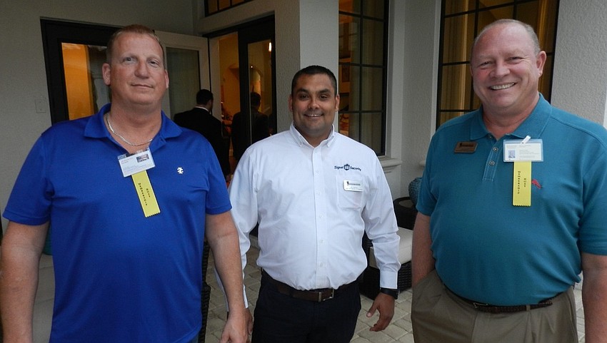 Geno Smolko, Lee Carter and Mark Monismith enjoy drinks and time with new friends.