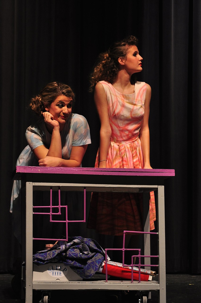 Marykate Crowley and TatianaÂ Galante take a break from sewing pajamas.