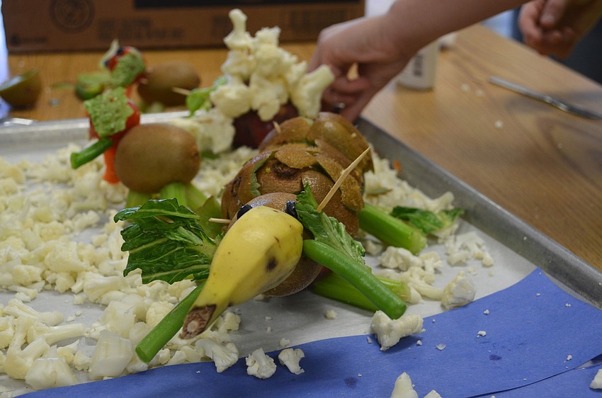 Students built a mammoth out of potatoes, bananas and other ingredients.