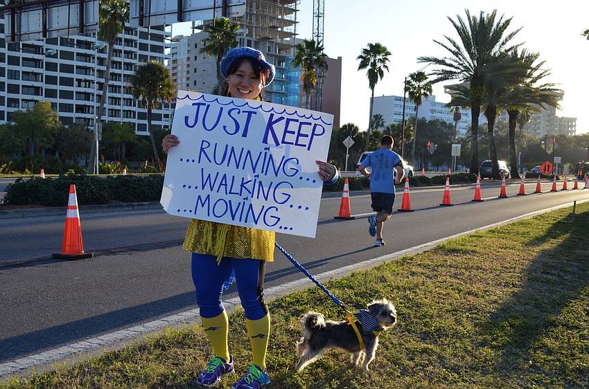 Krissy Murphy made a sign to cheer on runners.