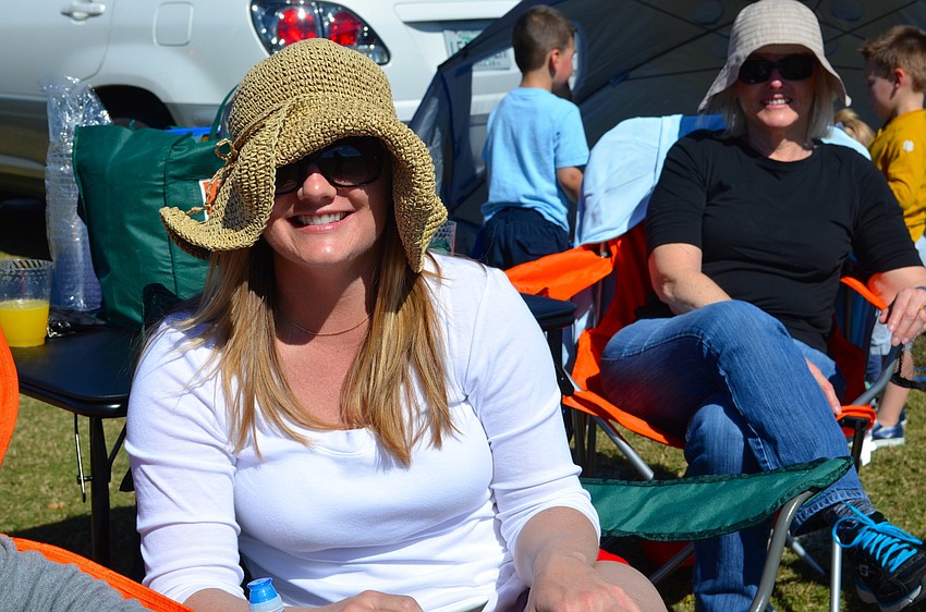 Kara Kosakowski shows off her polo attire: a floppy hat and sunglasses.