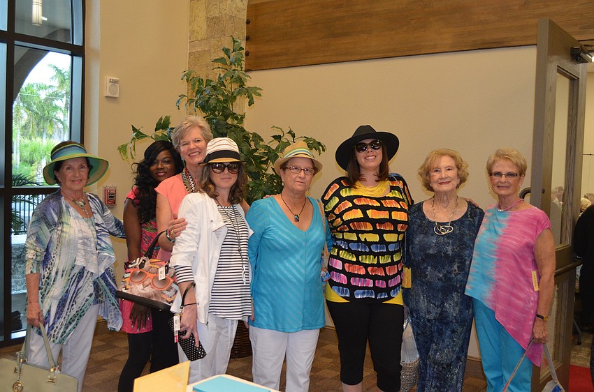 Models Sue Borgelt, Keisha Mazon, Bennie Dods, Erin Kelly, Ann Quackenbush, Nikki Hurst, Evey Huntington and Kit Torchia prepare to strut down the runway.