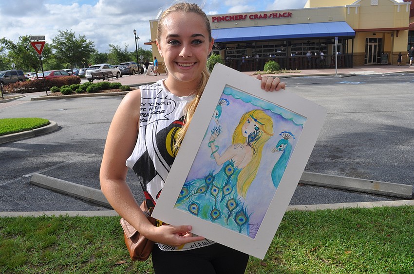 Brianna McVaugh, a sophomore, painted with watercolor to display a peacock theme.