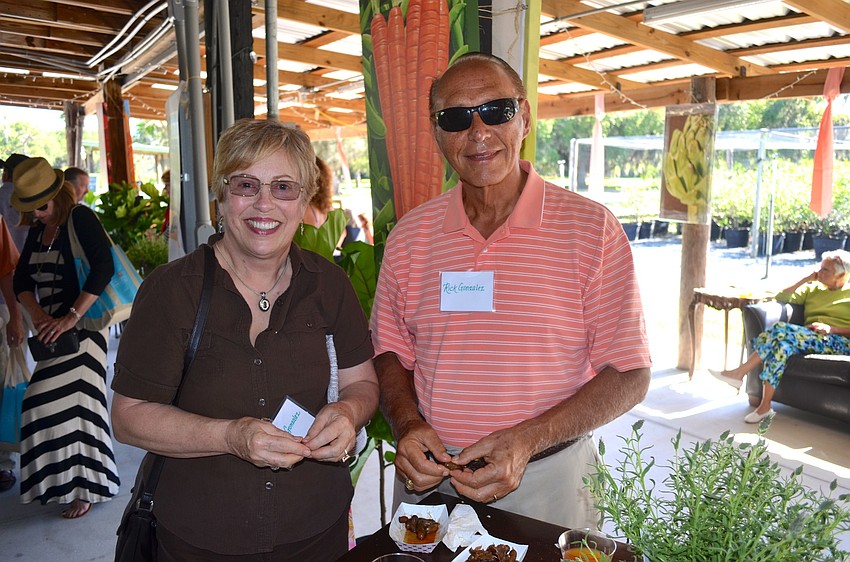 Carolyn and Rick Gonzalez snack on boiled peanuts.