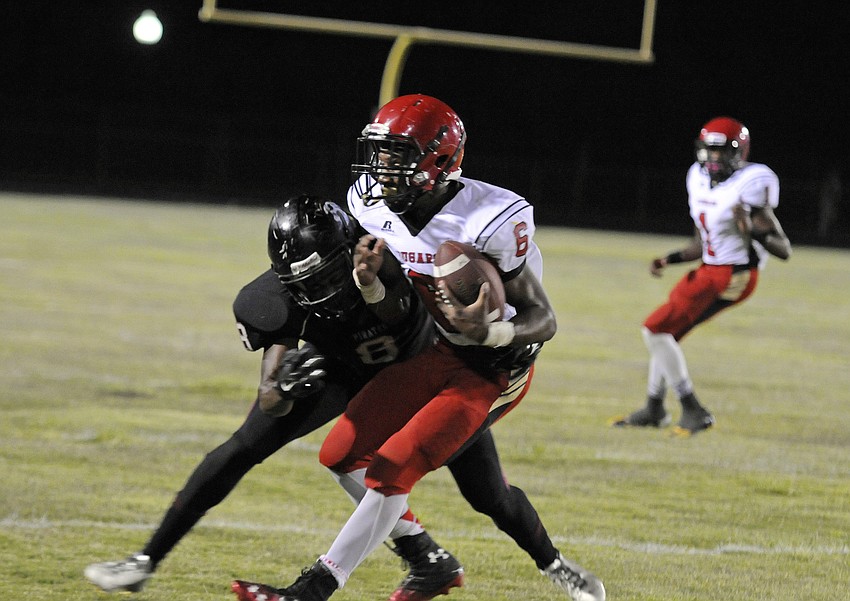 Cardinal Mooney wide receiver Sean Morris hauls in a pass late in the fourth quarter.