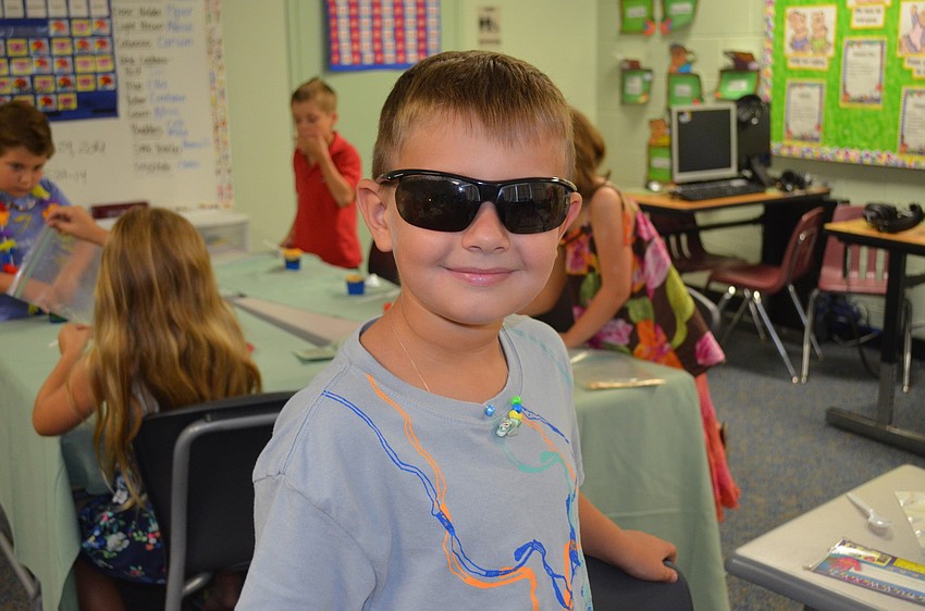 Michael Jakob wears sunglasses to the bash.