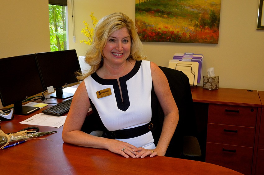 Alliance Executive Director Heather Kasten shows off her new desk.