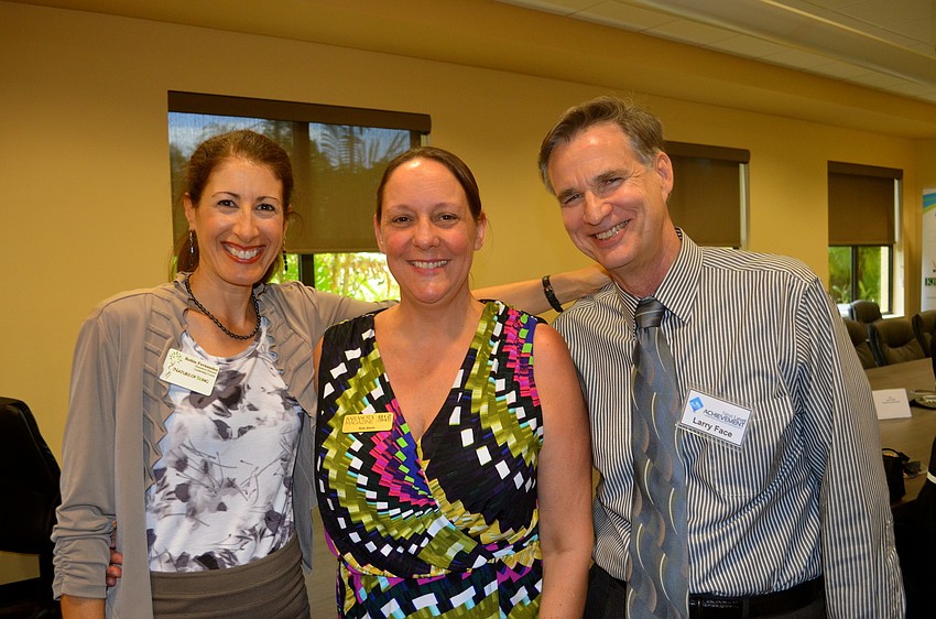 Robin Fernandez, Kim Davis and Larry Face tour the new facility.