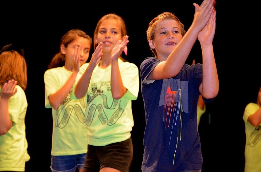 Jake Deglman and his classmates dance to the music.