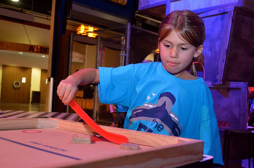 Caroline Coyne focuses on a game.