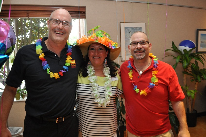 Gris Betle, left, and Justin Mattina, right, plan to open Chicken Kitchen in the East County in the fall. They are pictured with Yasemin Chain, center, of the ComCenter.