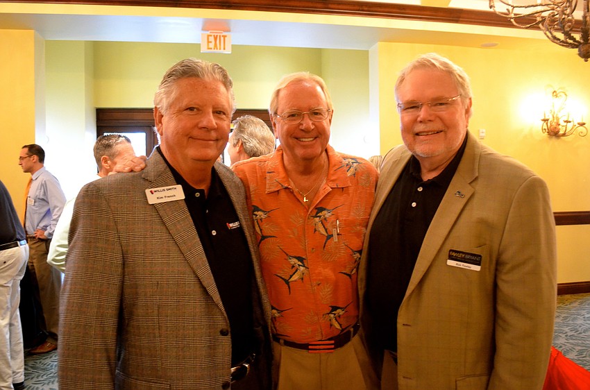 Kim French, Dr. Warren Simonds and Rick Fawley network while waiting for lunch.