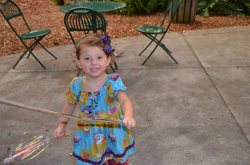 Reese Lawrence makes a sword out of a piece of palm.