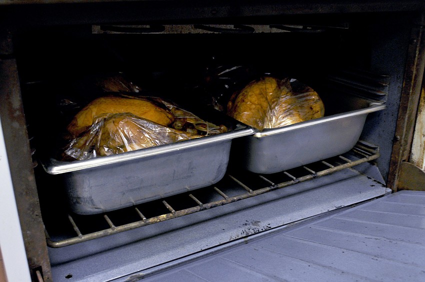 Turkeys roasting in the oven before guests sit down for Longboat Island Chapelâ€™s Thanksgiving Dinner.
