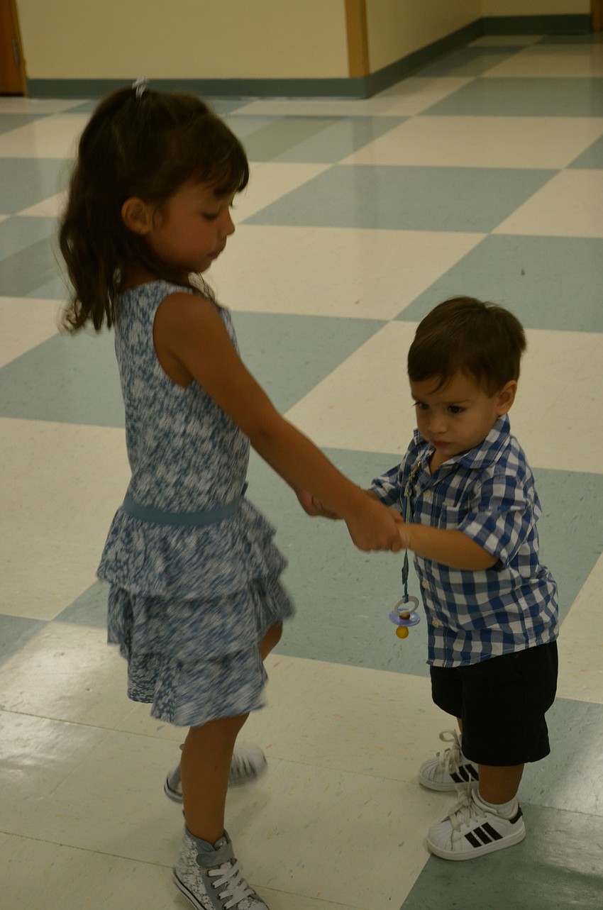 Jaslene Ulloa and Benjamin Matute dance to the music.