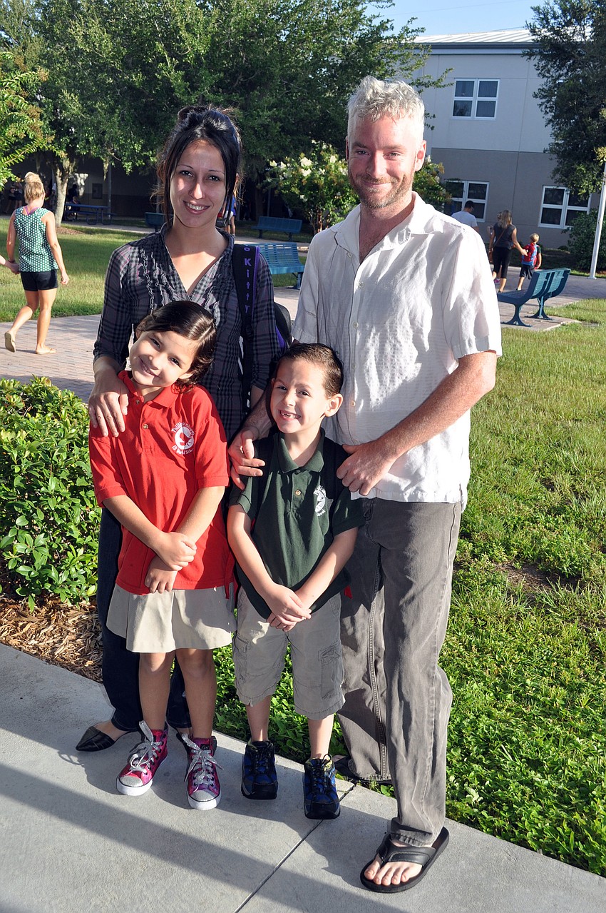 Nora Diaz and Joe Smith with second grader Leelee Lapham and first grader Mark Lapham