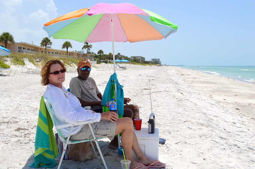 Carroll Berry and Dexter Bure relax on the beach after traveling together from Boston. The pair will be in town for a week.
