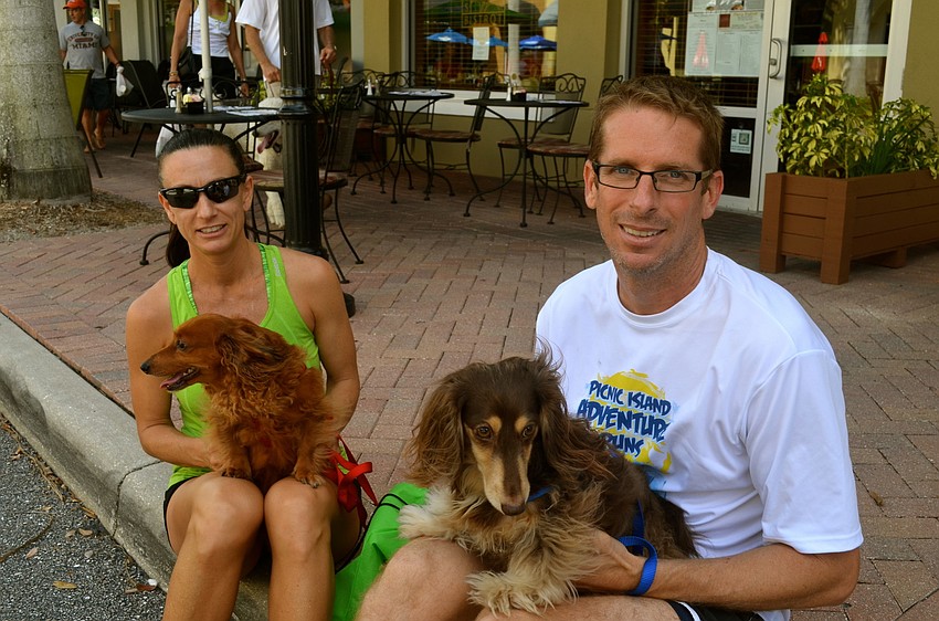 Stacey and Mike Gilkison hold their fur babies â€” Alfie and Donny.