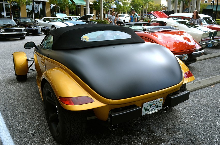 The event features original and revamped models of classic cars.