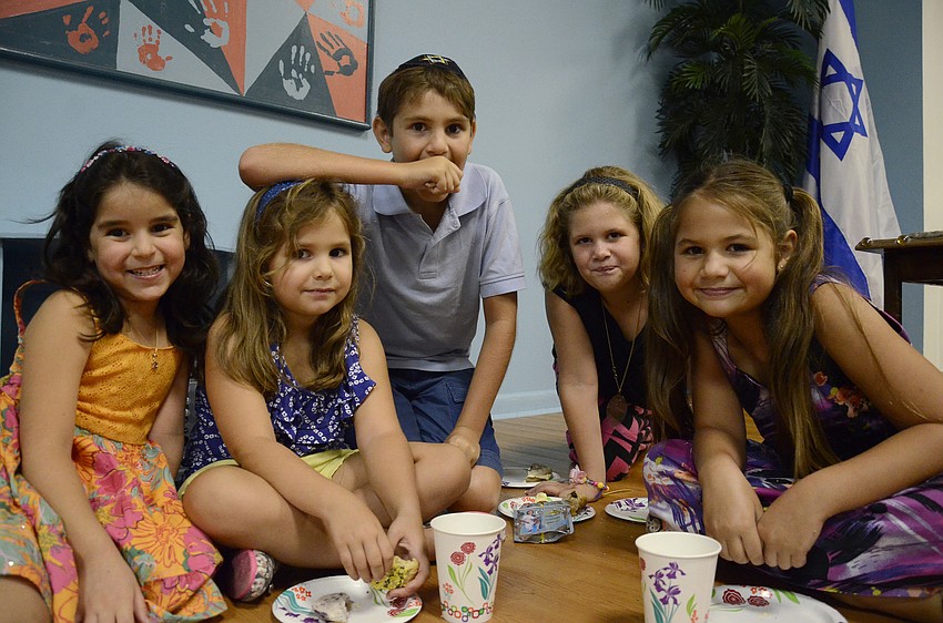 Simone Velez, 5, left, hangs out with Emma Witherspoon, 4, and her siblings, Robert, 10, Madison, 8, and Alexandra, 8.