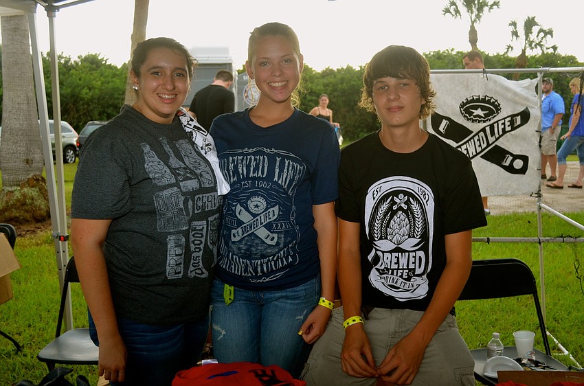 Bianca Kaufman, Noelle Townsley and William Smith sell Brewed Life T-shirts.