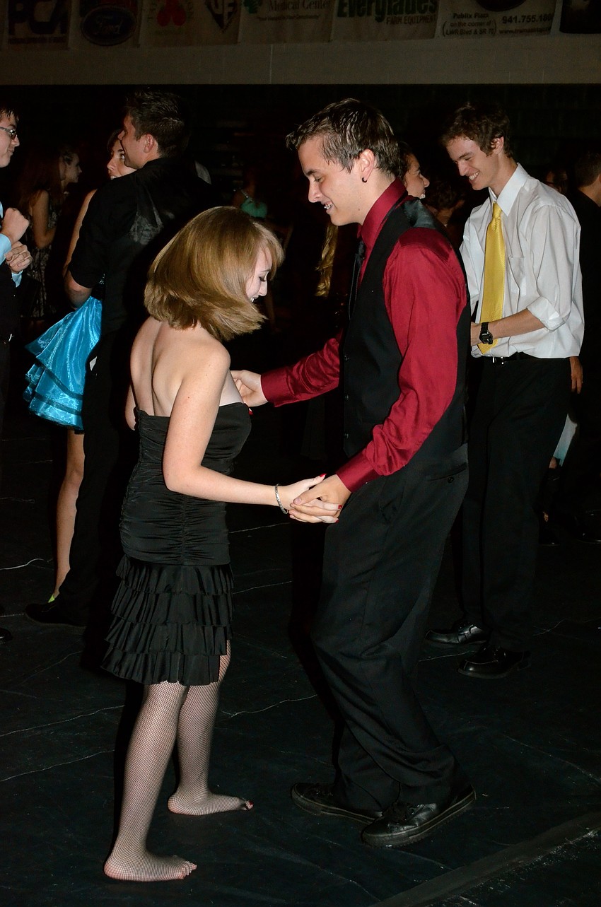 Nina Otero and Brian Cobey dance to the music.