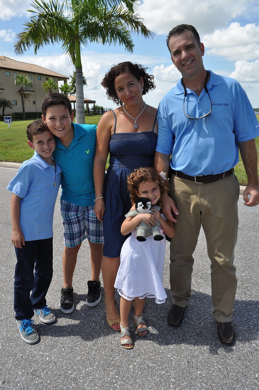 Chaz, Ethan, Angela, Skyla and Tony Campano enjoy the day together. Tony Campano works for Neal Signature Homes.