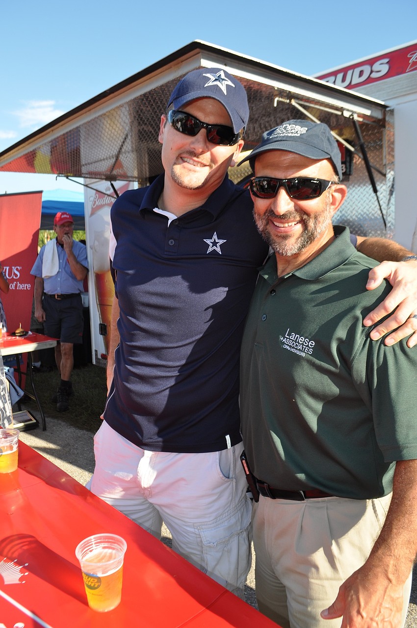 Wells Fargoâ€™s Chris DeLeonardo and Lanese and Associatesâ€™ Rick Lanese serve as celebrity bartenders.