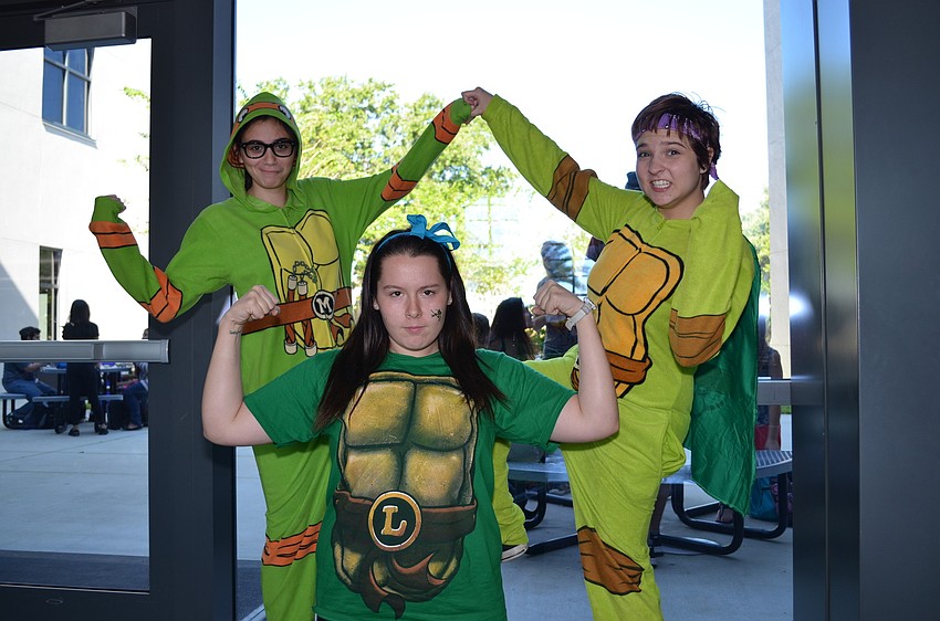 Friends Jamie Riccobono, Audrey Wilhelm and Emily Massa dressed as members of the Teenage Mutant Ninja Turtles.