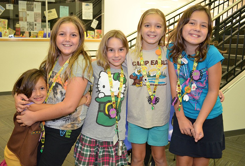Stefani, Angela, Lexie, Stephanie and Abigail- Members of troupe 415 attend the Scout About the Library event.