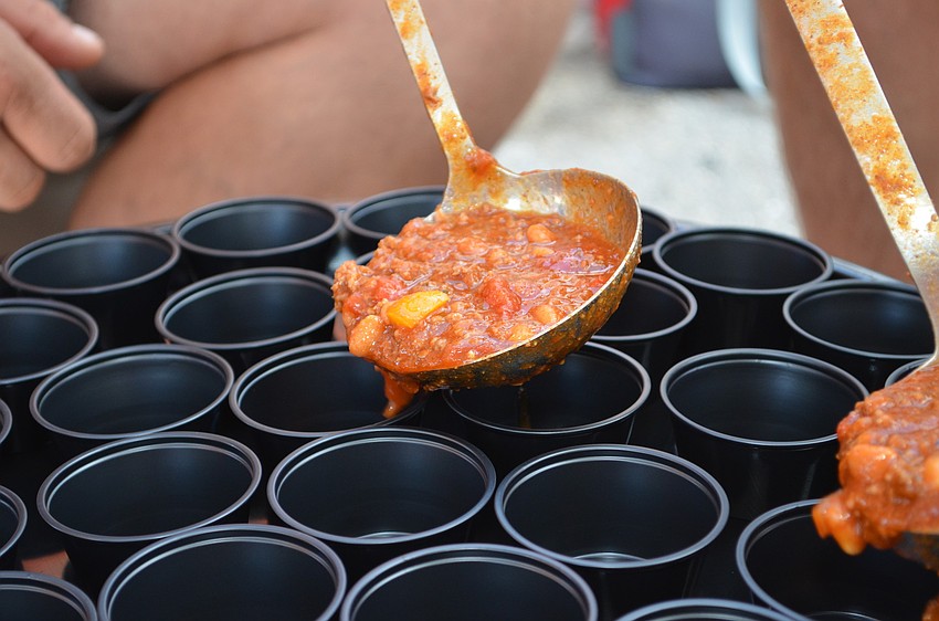 Attendees has the opportunity to sample chilis entries from dozens of participants.