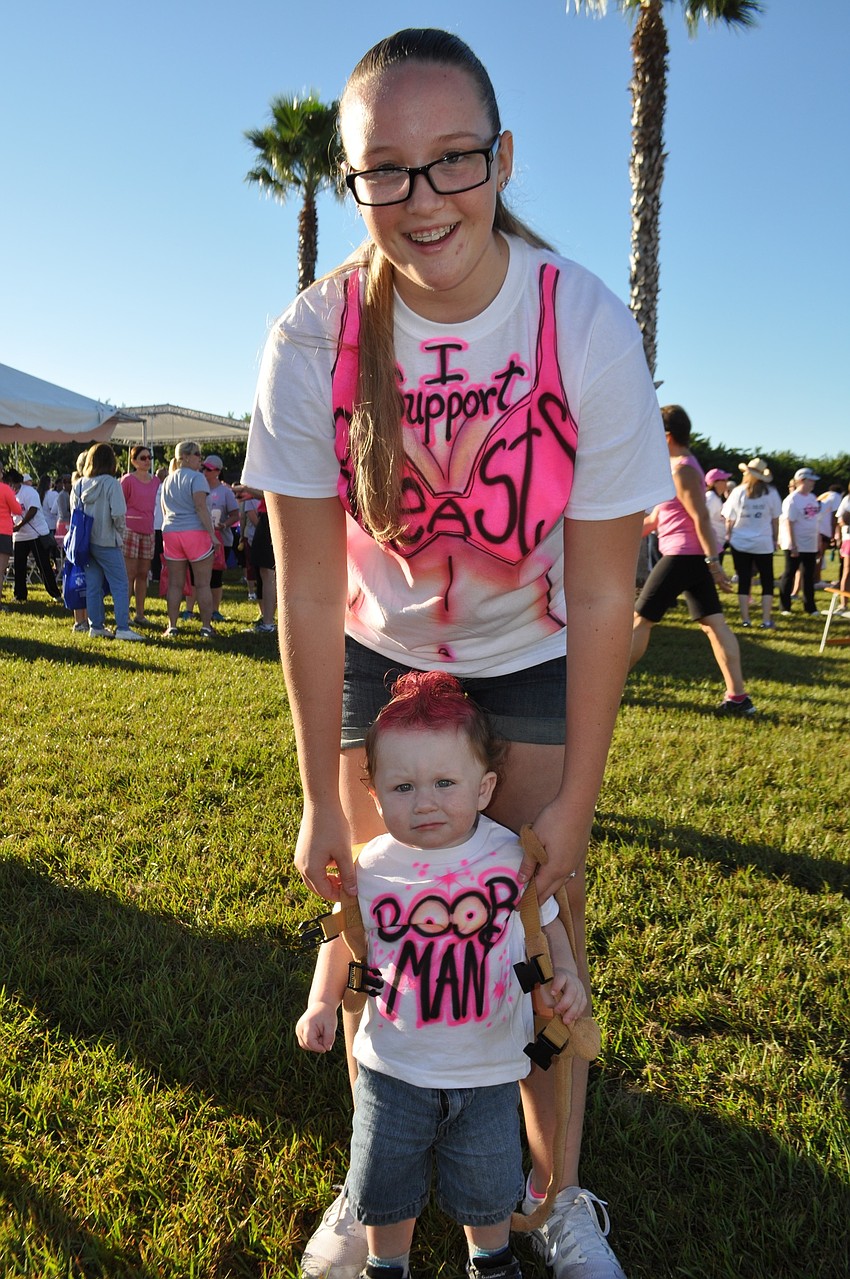 Alyssa Doss and her nephew Bo Cramer sport breast-themed T-shirts.