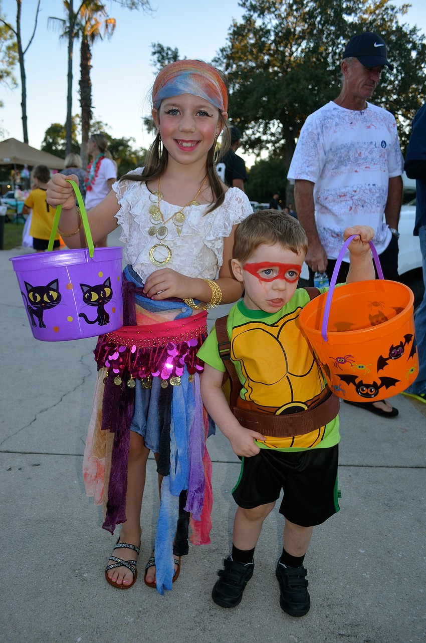 Emily and Eric Davis show off the candy they received throughout the night.