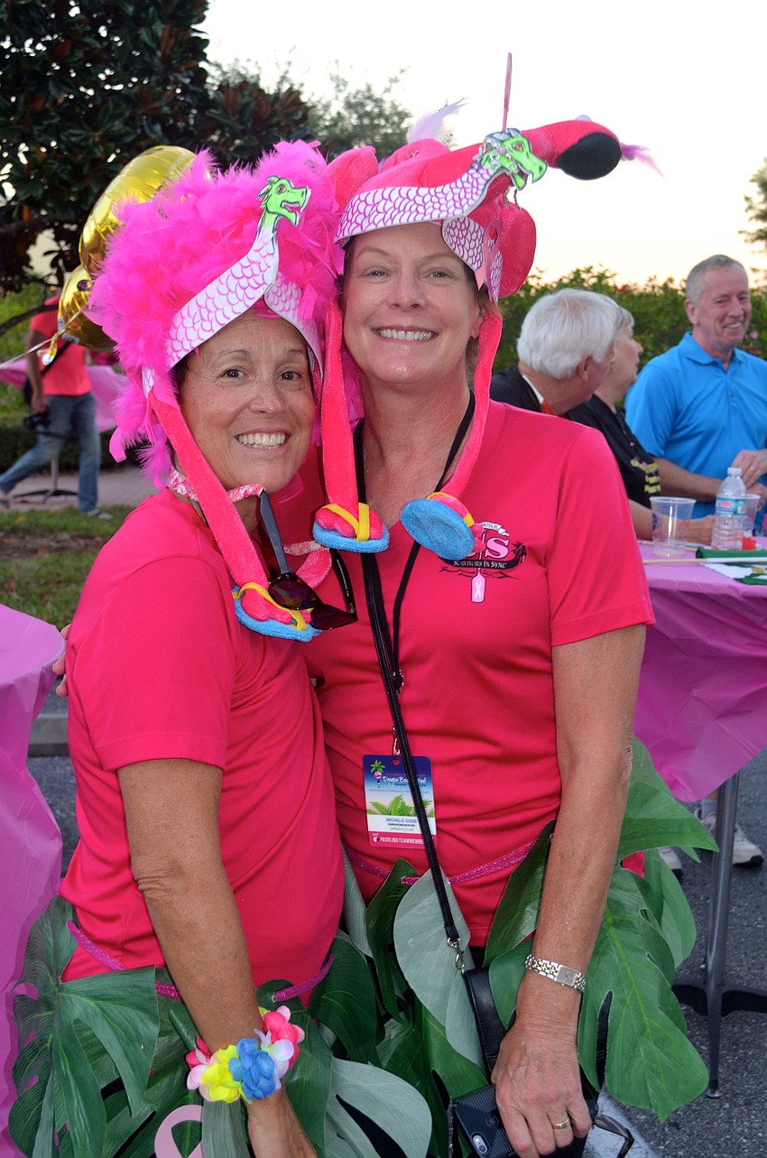 Sarasota residents Elyse Black and Michele Doss show support for breast cancer survivors.