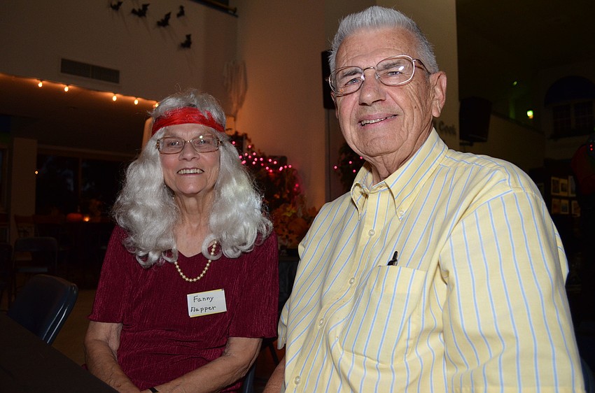 Audrey Hill and Bob Olson attend the Halloween dance party.