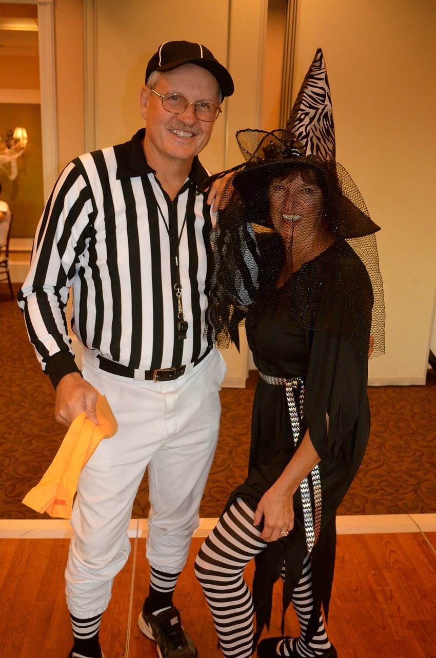 Charlie Whitler throws a yellow (penalty) flag at his wife, Marilyn.