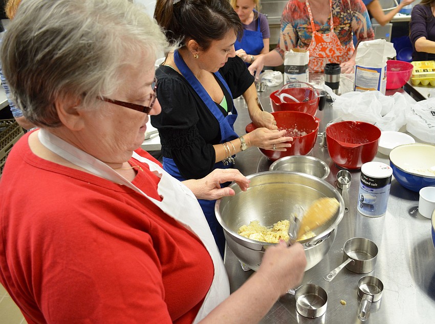 Joanne Haiby mixes the ingredients to make the challah dough.
