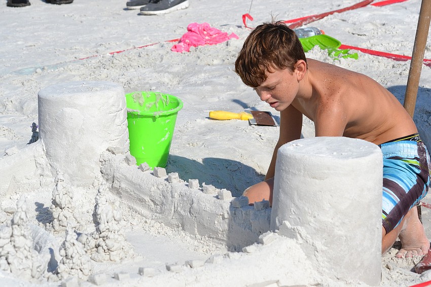 Erik Epp works on a sand castle for the amateur competition.